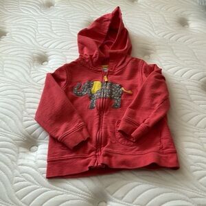 Girls pink jacket with elephant on front.